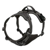 A black adjustable no-pull dog harness with reflective strips and a handle.