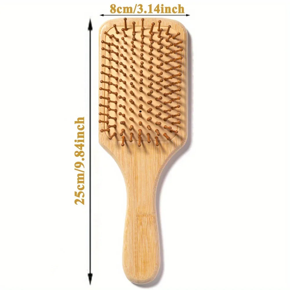 A wooden bamboo hair brush with massage bristles shown vertically.