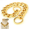 A gold Cuban link training collar with a slip chain and a large ring is displayed on a white background.