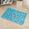 A blue pet training mat featuring orange and white fox-like designs for dog training.