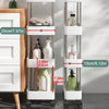 A white mobile storage rack with three tiers holding various bottles and containers next to a wooden cabinet.