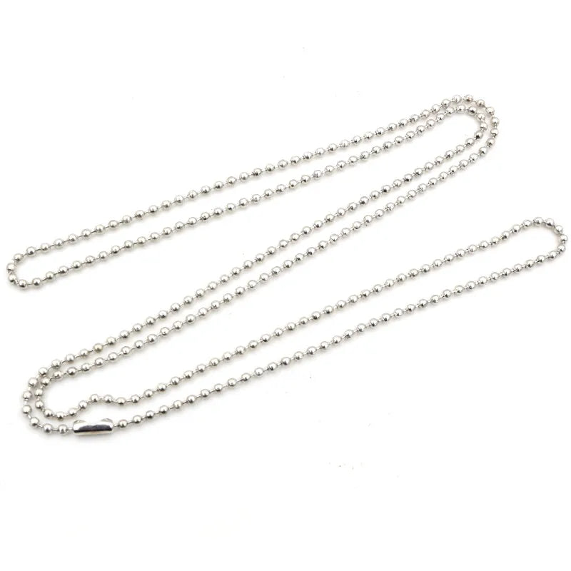 A set of delicate silver-toned ball bead necklaces displayed on a white background.