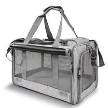 A gray soft-sided pet carrier for cats and puppies with a handle and mesh window.
