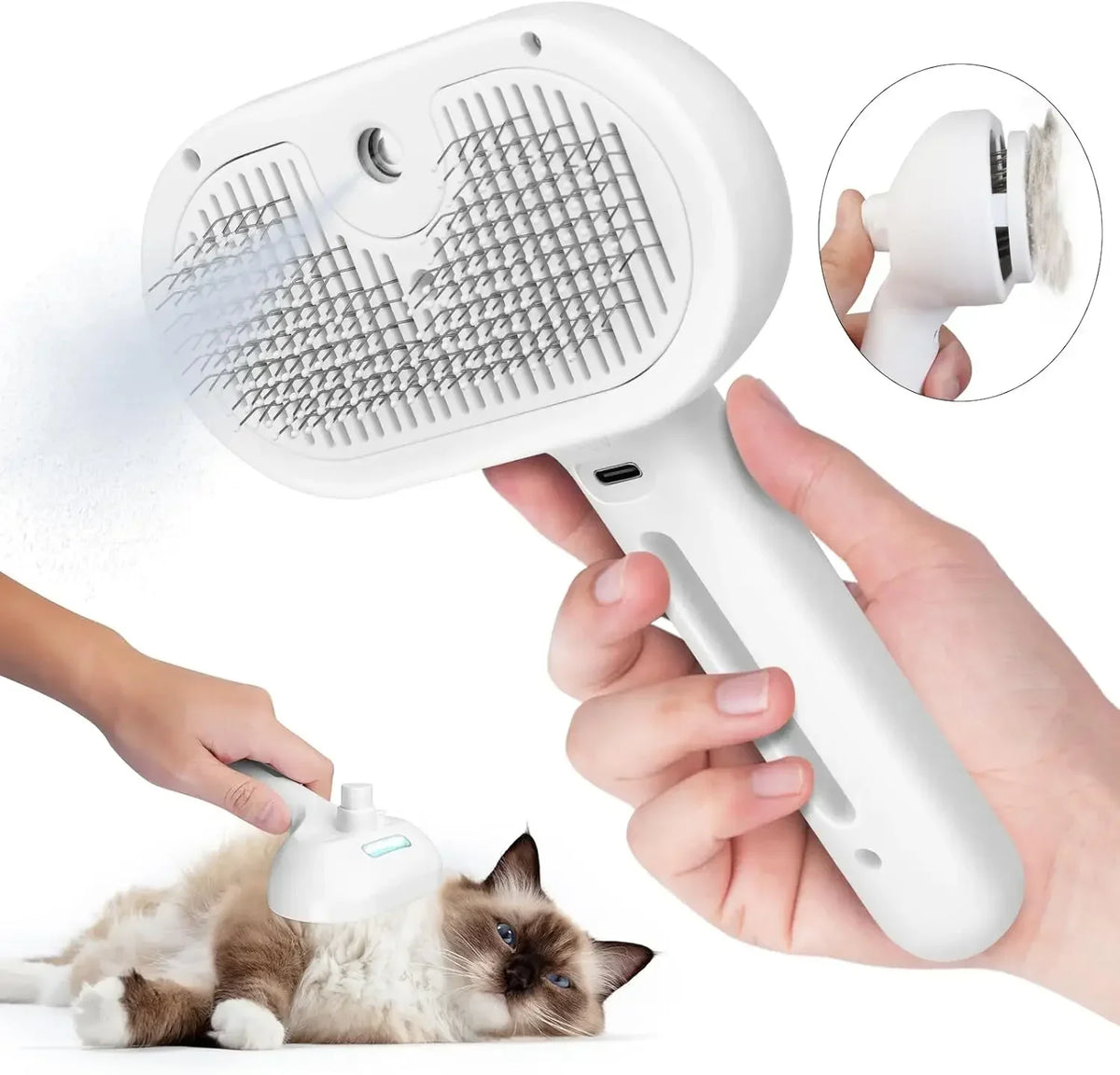 Una mano sostiene un peine para pelaje blanco y un cepillo de vapor, demostrando su uso en un gato.