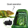 A green reptile drinking water filter fountain with a leafy plant inside, demonstrating quiet operation.