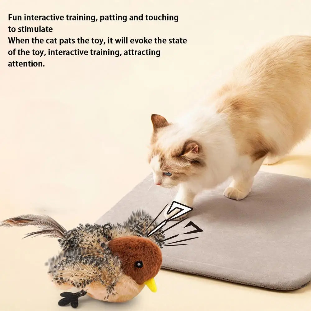 A fluffy, brown and white bird-shaped cat toy is shown on a gray mat.