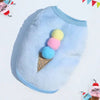 Light blue fleece puffer vest with colorful pom-poms on the chest