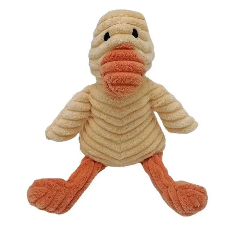 A plush toy resembling a bird or animal with light brown fur and an orange beak and feet.
