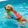 A golden retriever wearing a red and green X-Sports life jacket swims in blue water.