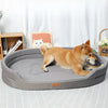 A golden-colored dog is lying on a gray washable waterproof dog bed mat.