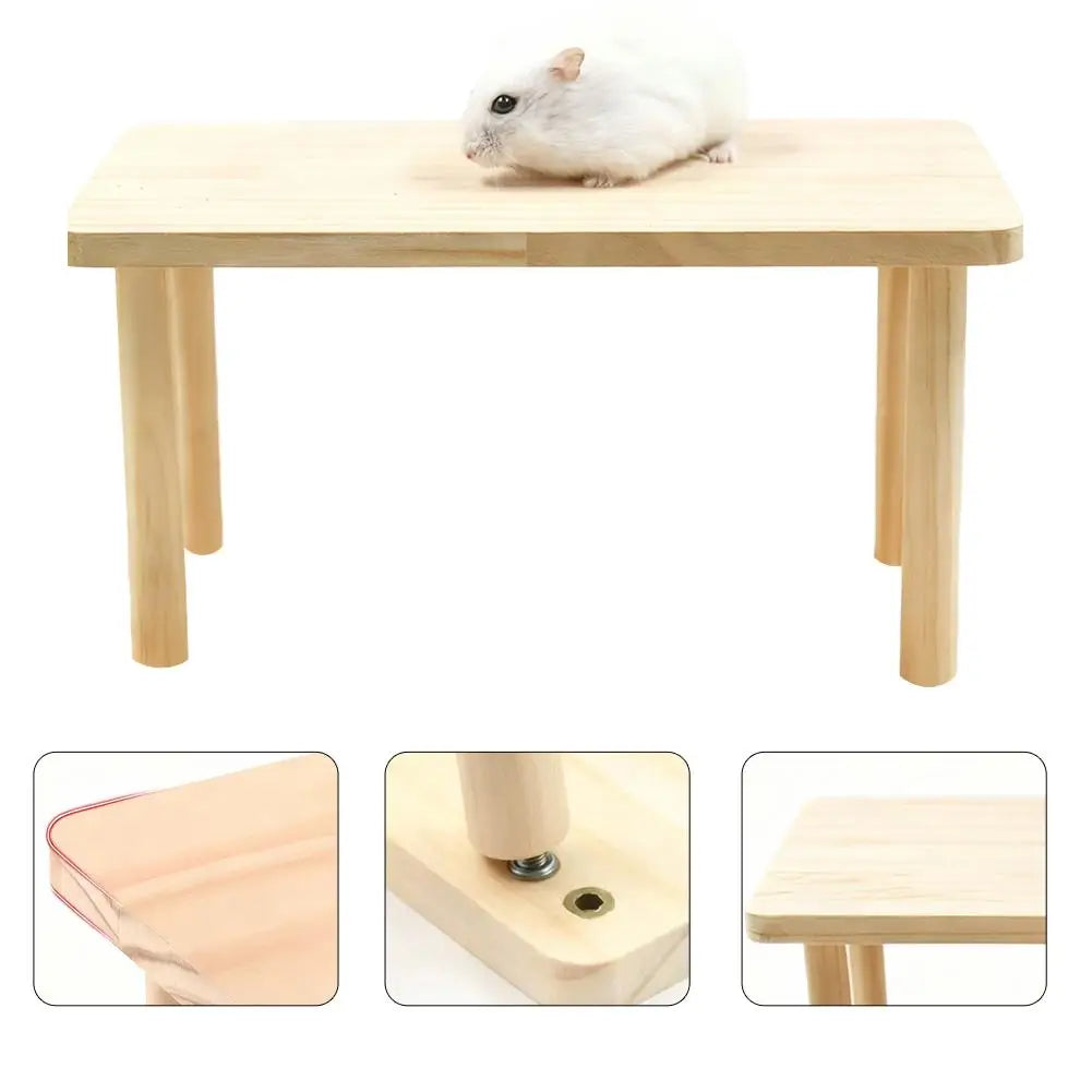 A white hamster is sitting on a wooden climbing platform designed for hamsters.
