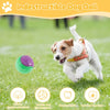 A dog is playing with an indestructible dog ball in a grassy field, demonstrating its use for cleaning teeth.