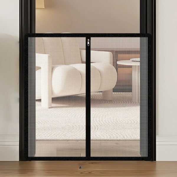 A black foldable metal mesh pet gate and barrier with a glass panel, shown in a doorway.