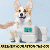 A fluffy dog is looking at a hand holding pet wipes and stacked white wipes boxes.
