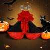 A black and red vampire cat cape and collar costume set with a silver cross accessory and a black cat figure.