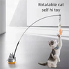A cat is playing with a rotatable cat self hi toy wand that has a bell attached.
