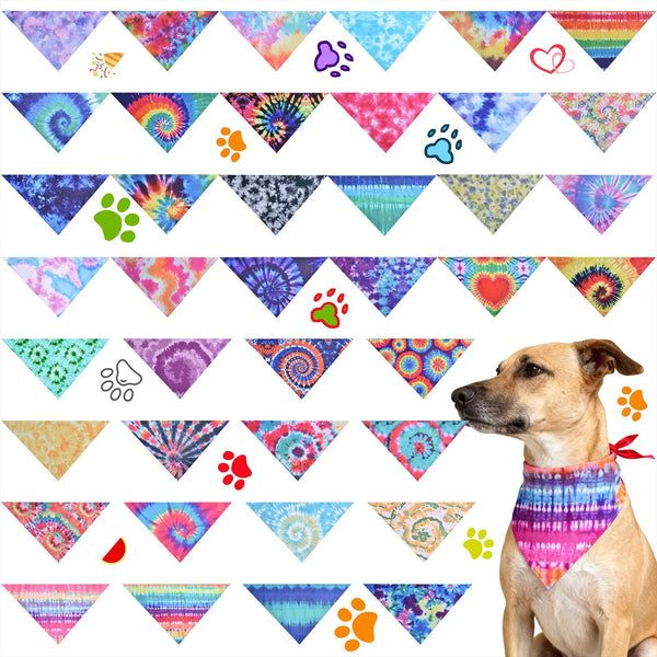 A collection of colorful tie-dye fabric triangles featuring paw prints and hearts for dog accessories.
