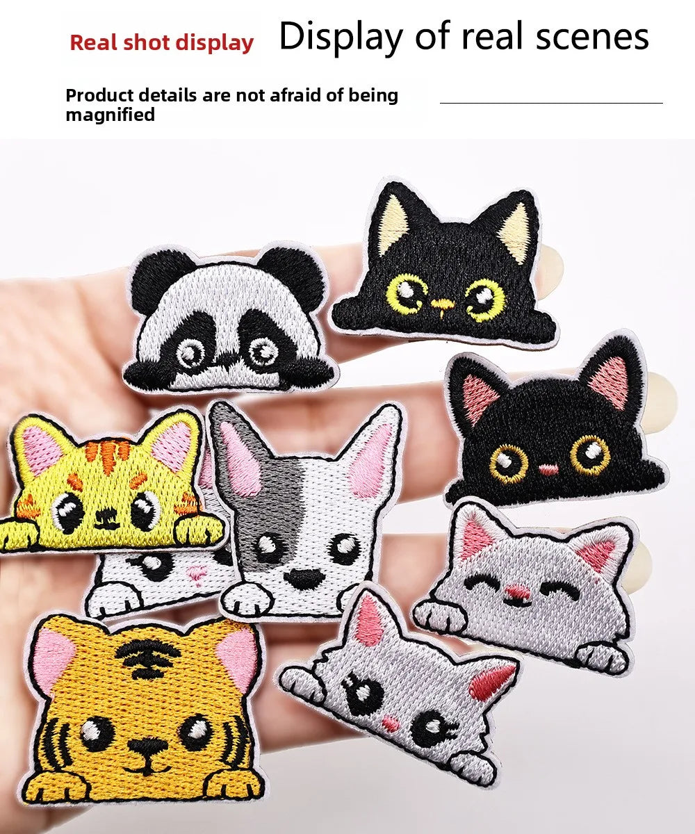 A collection of embroidered cat patches in various styles and colors, including black, yellow, gray, and white.
