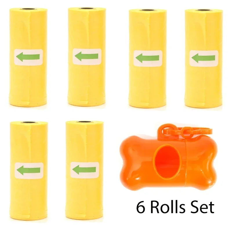 A set of six yellow rolls for a reusable pet poop bag dispenser with an orange leash clip.