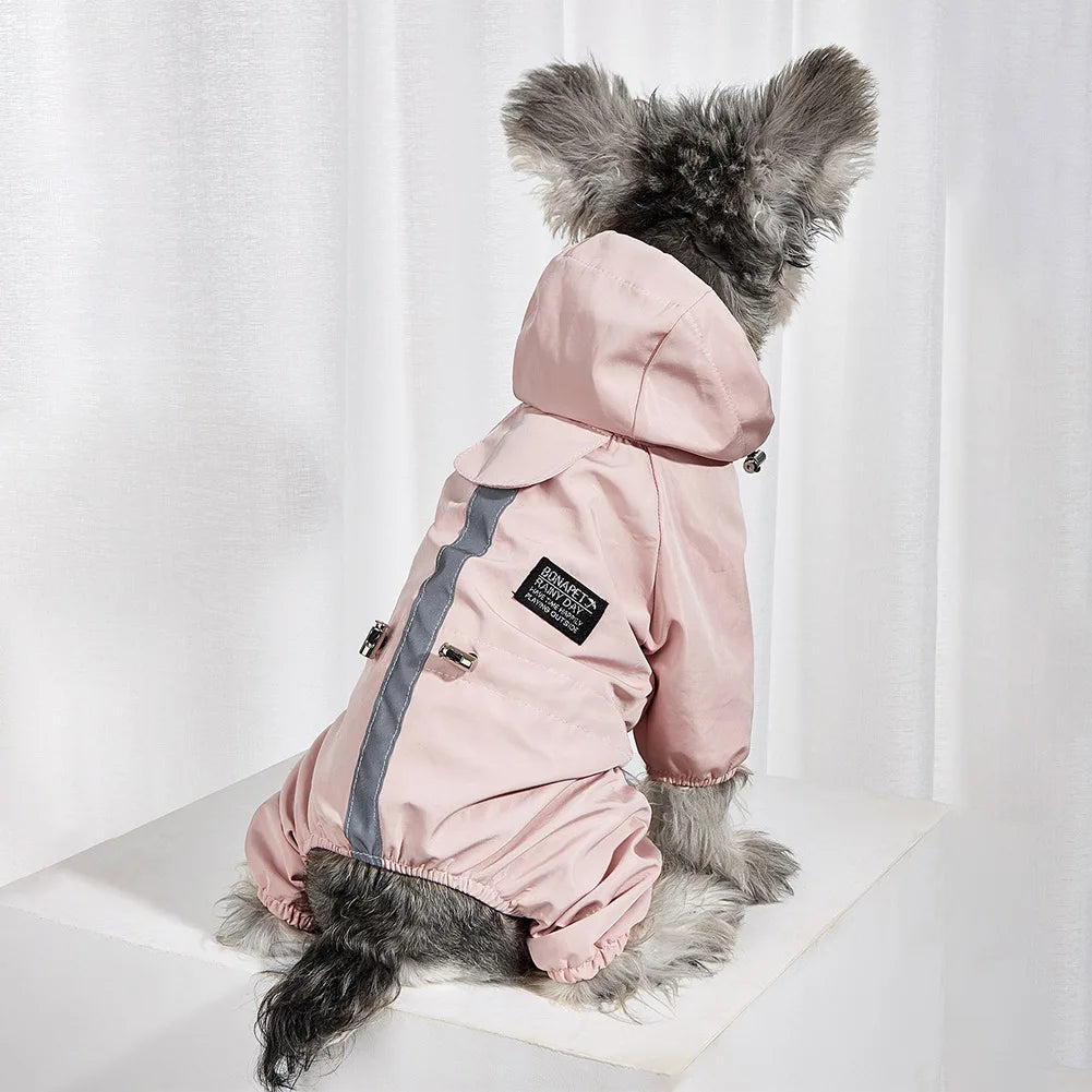 A pink waterproof reflective dog raincoat and jumpsuit displayed on a white surface.
