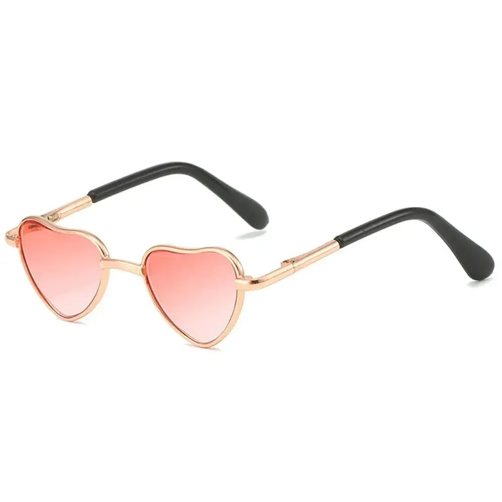 Pink heart-shaped pet sunglasses with gold-toned metal frames for cats and dogs