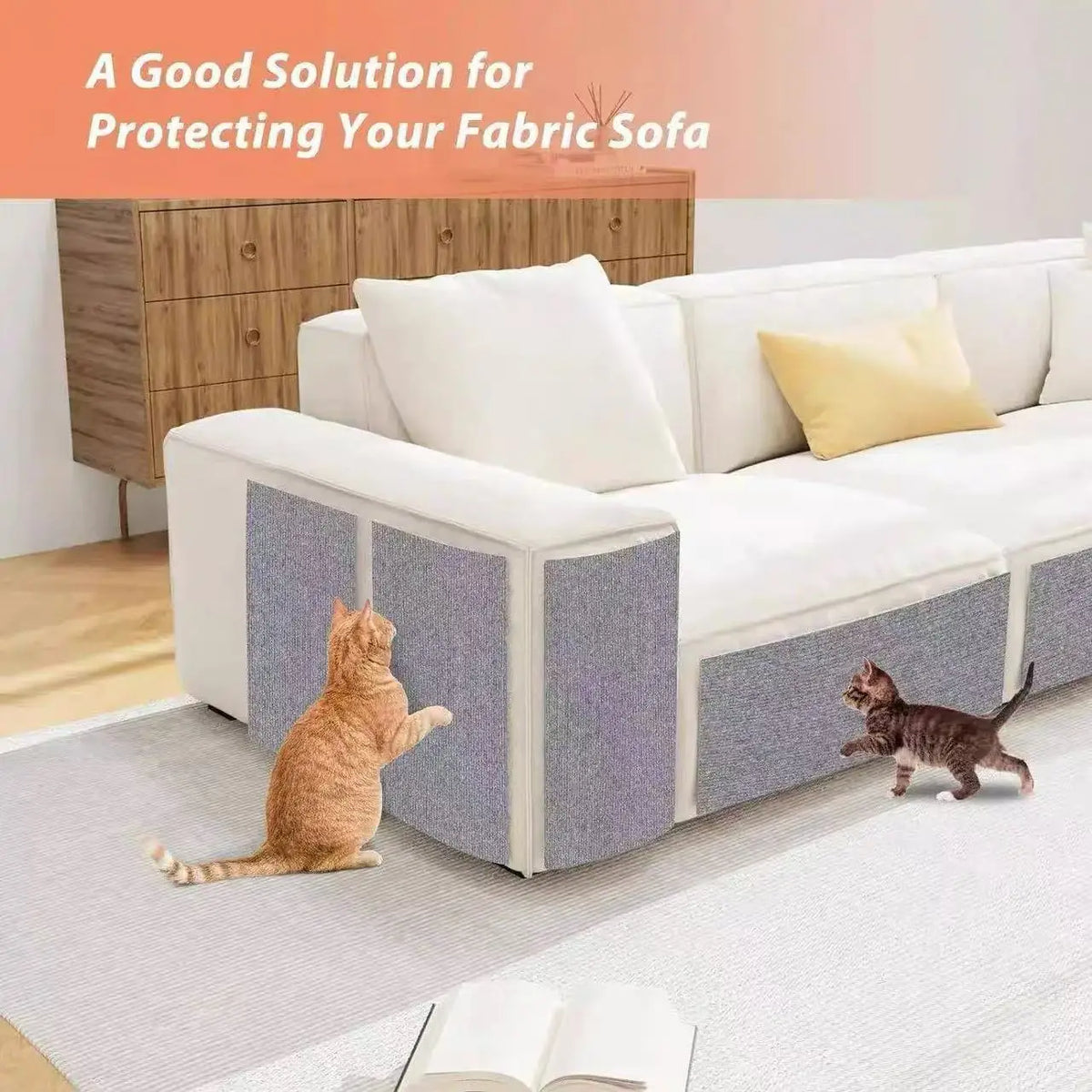 A self-adhesive cat scratching mat protecting a fabric sofa, with two cats playing on the mat.