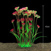 Un amas de plantes aquatiques artificielles réalistes avec des feuilles roses et rouges poussant à partir d'un substrat.