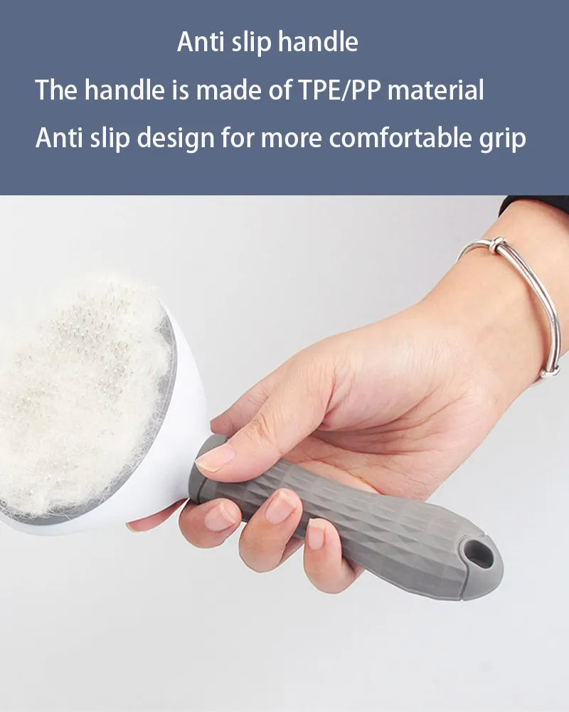 A hand is holding a gray anti slip handle of a pet hair removal brush with massage pins.
