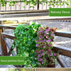 A display of artificial green ivy and purple foliage used for balcony and fence partition decor.