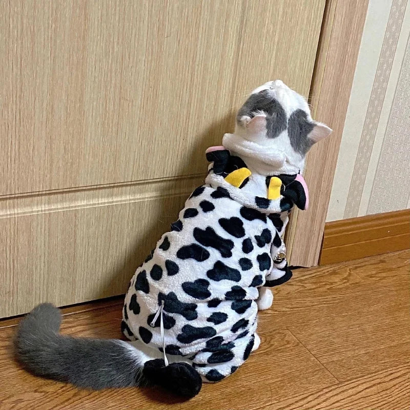 A plush cat costume resembling a leopard or cheetah with black and white spots, gray fur, and a hood.