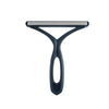 A dark gray 2-in-1 pet hair remover and fabric shaver tool with a flat shaving plate and a curved handle.