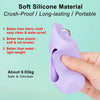 A hand holds a purple silicone material product used as a poop bag dispenser or storage holder.