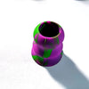 A close-up view of a silicone bat grip knob with a vibrant purple and green marbled pattern.