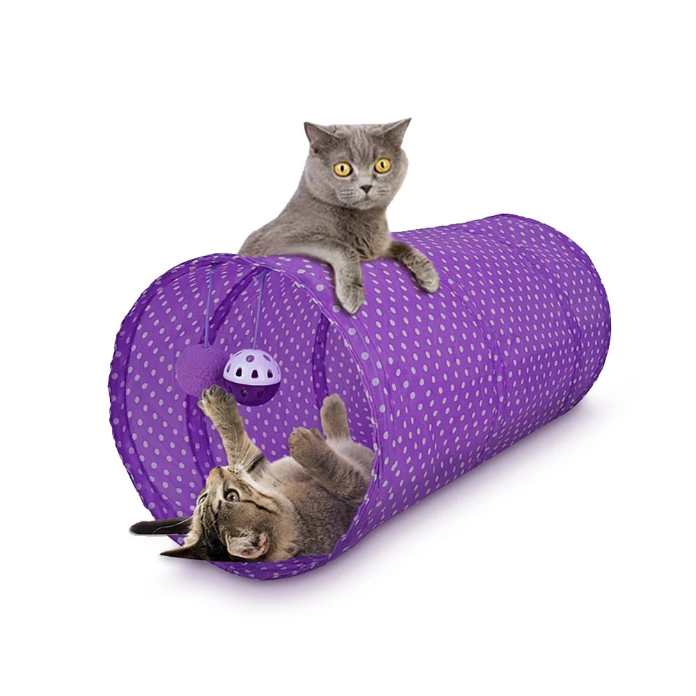 A gray kitten is playing inside a purple collapsible cat tunnel with a ball.