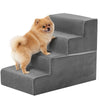 A fluffy orange dog is standing on a gray adjustable pet climbing stairs ramp for dogs.
