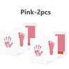 Two pink baby handprint and footprint kits displayed on a white background.