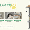 A multi-level cat tree made of sisal rope featuring perching platforms, dangling balls, a condo, and a hammock.