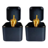 A pair of dark blue wooden prank boxes with gold hand figures inside.
