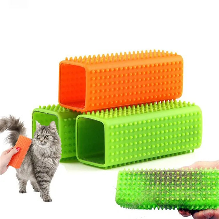 A set of orange and green pet hair removal brushes with silicone bristles shown next to a cat.
