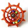 An orange interactive parrot spinner rattle toy with a central hub and colorful balls.
