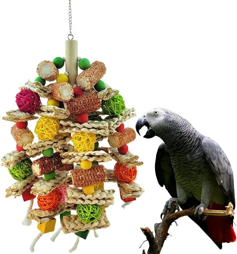 A wooden parrot swing toy for budgies shaped like a tree, featuring various colored balls and natural fibers.