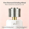 Close-up of a fine diamond grinding wheel with a brass rotating shaft and a white housing for a pet nail trimmer