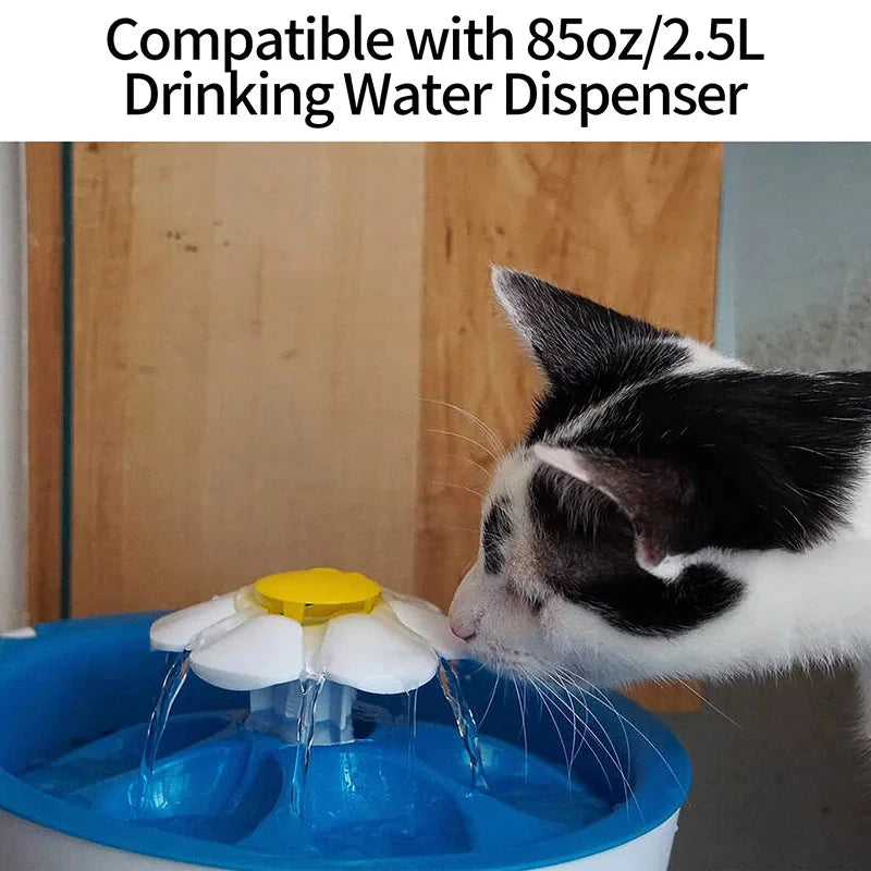 A cat is drinking water from a blue pet fountain, which is compatible with an 85oz or 2.5L dispenser.