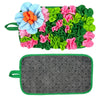 A mat featuring colorful fabric flowers in shades of blue, pink, and green for interactive pet foraging.