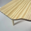 A light wood hamster play platform with a two-level design, showing the natural grain and angled edge.
