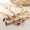 Natural silvervine cat chews and dental health toys featuring dried plant material and feathers.