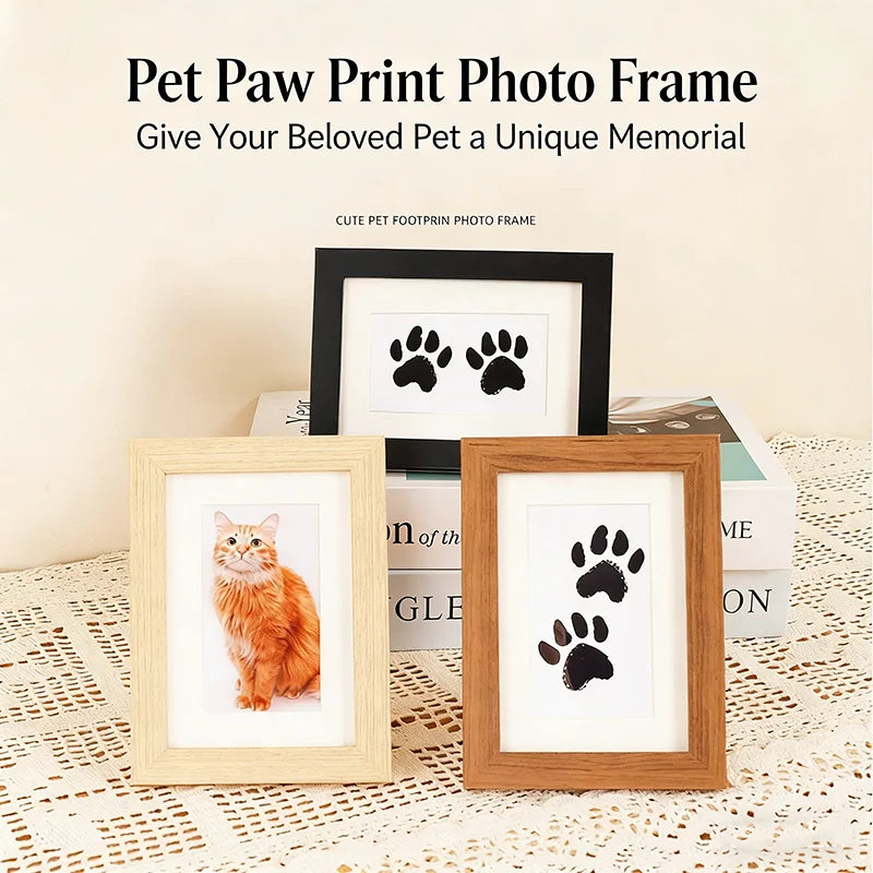 A wooden photo frame featuring a black paw print design, displayed on a textured surface.