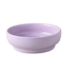 A purple ceramic cat and dog bowl with a matching stand.