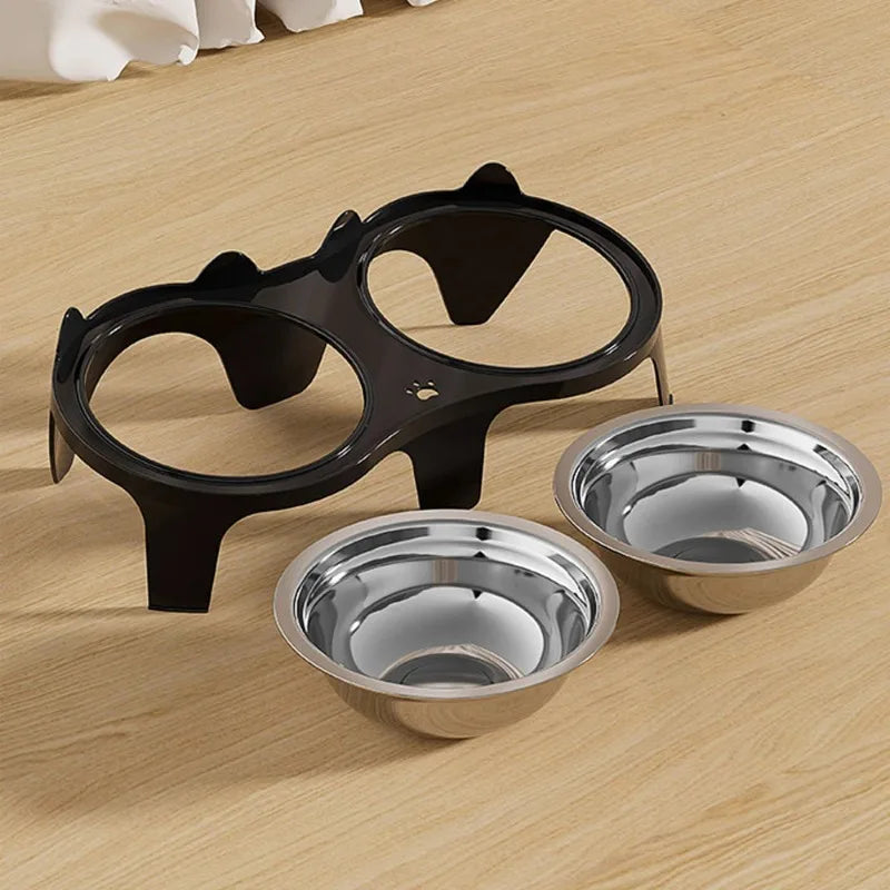 A black anti-tip stainless steel double pet bowl is shown on a light wooden surface.