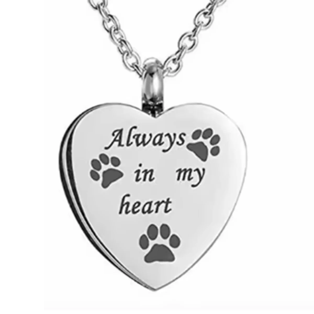 A silver stainless steel heart-shaped necklace with paw prints engraved on it.